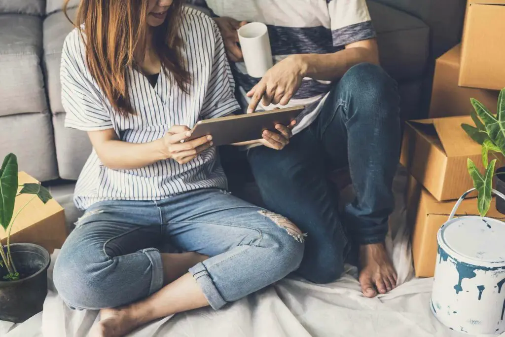 Couple purchasing items on Amazon through a tablet